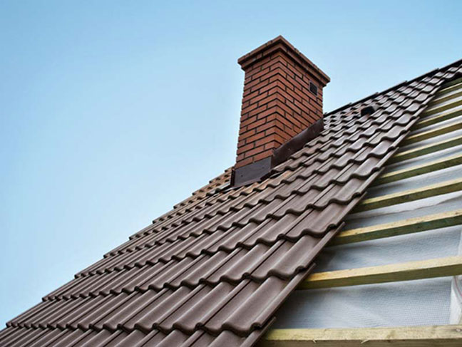 New tile roof with a brick chimney