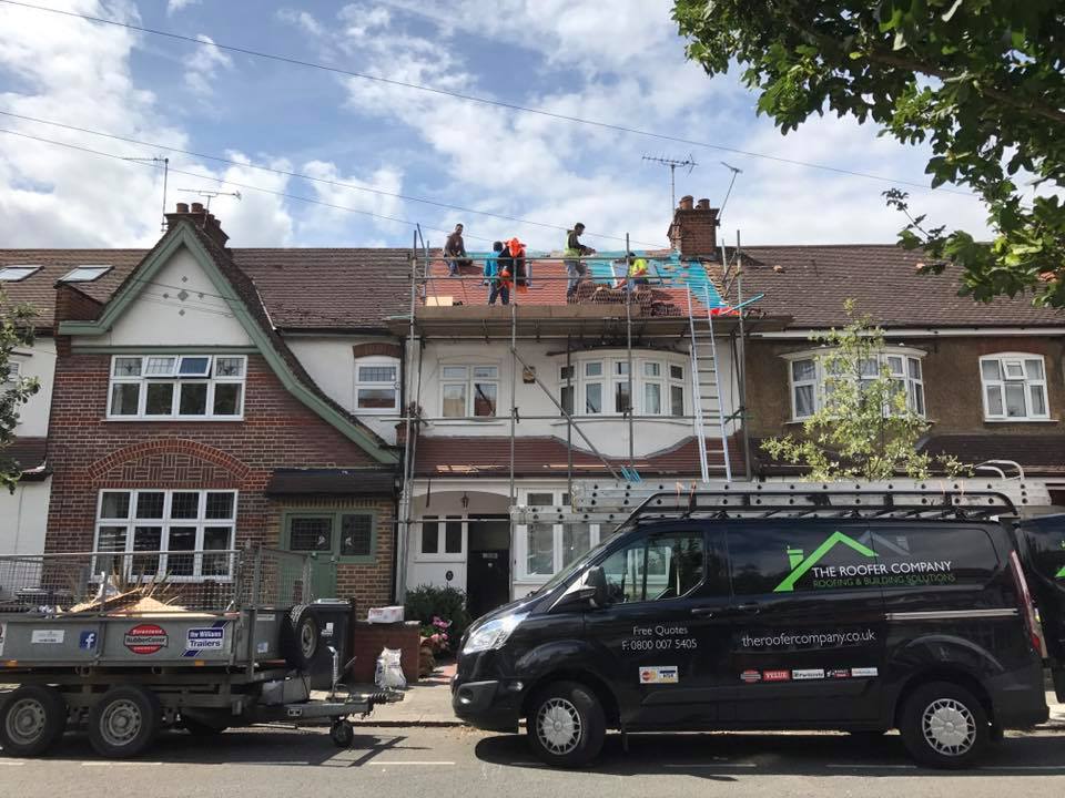 The Roofer Company team re-roofing a terraced house
